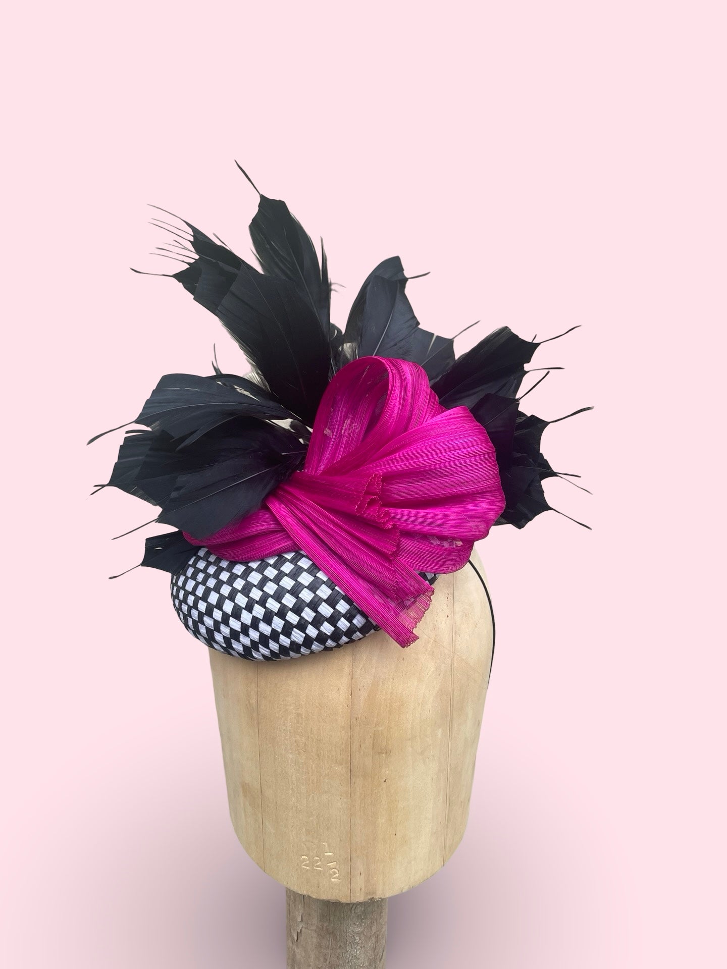 Black and white check straw pillbox with black feather spray and fuschia silk Abaca bow