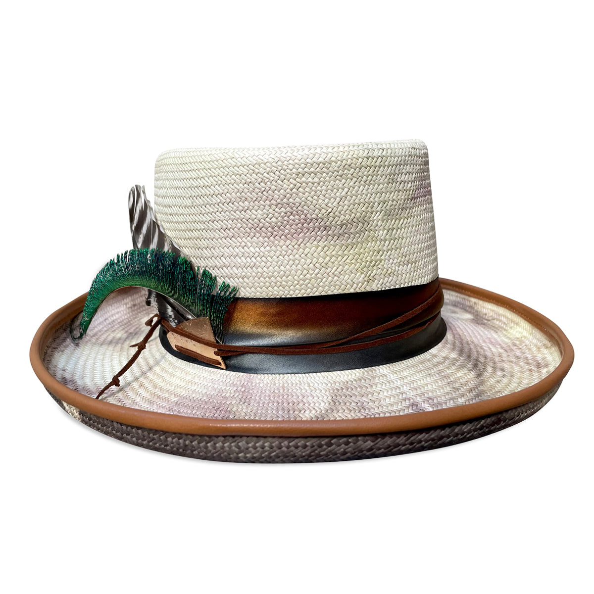 The 'Cha Cha' hat featuring a tie-dye design, a gently upturned brim for flattering contours, and bohemian-style silk and suede decorations.