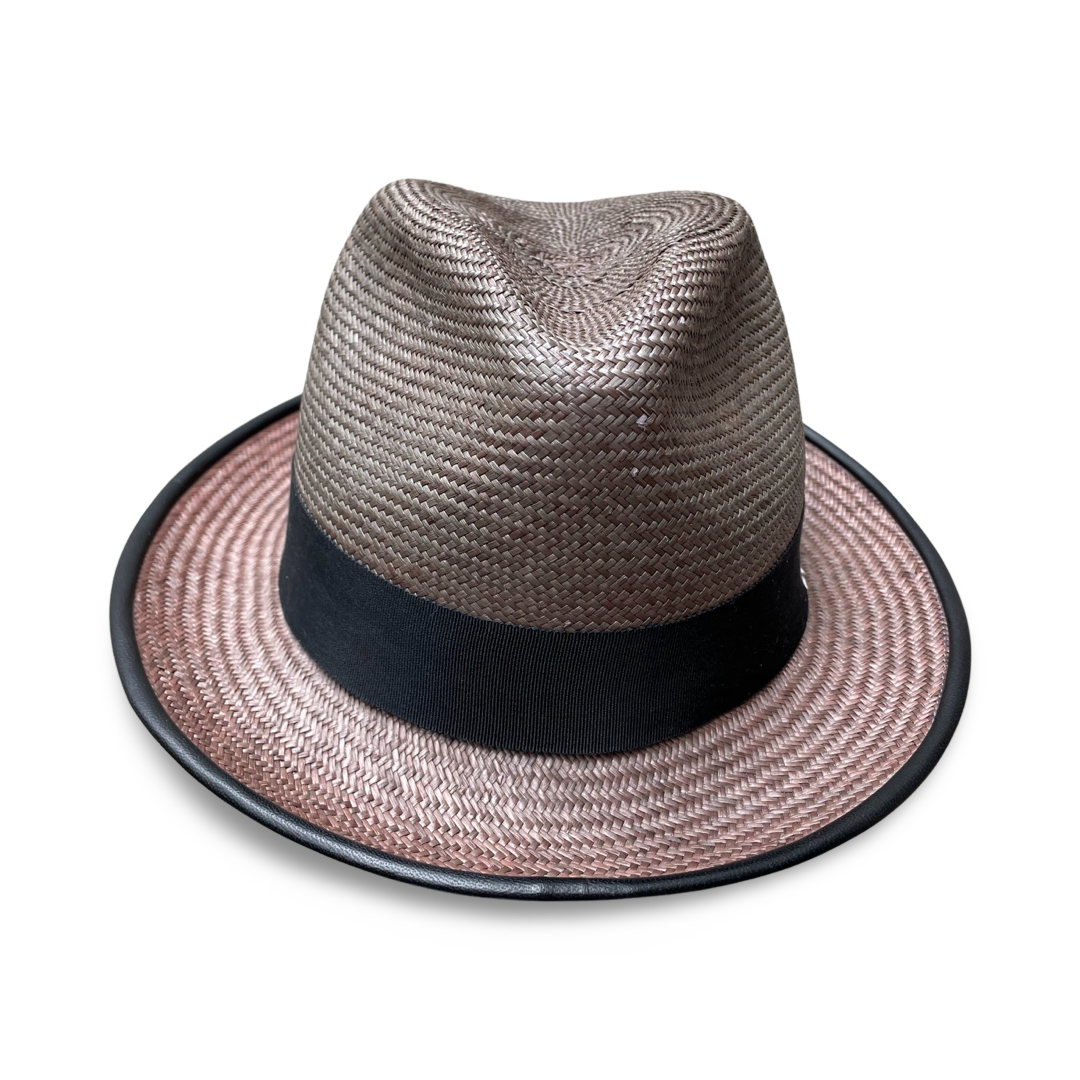 Gray Panama straw fedora with a 2" brim. Brim is piped with leather and hat features a black grosgrain trim. 