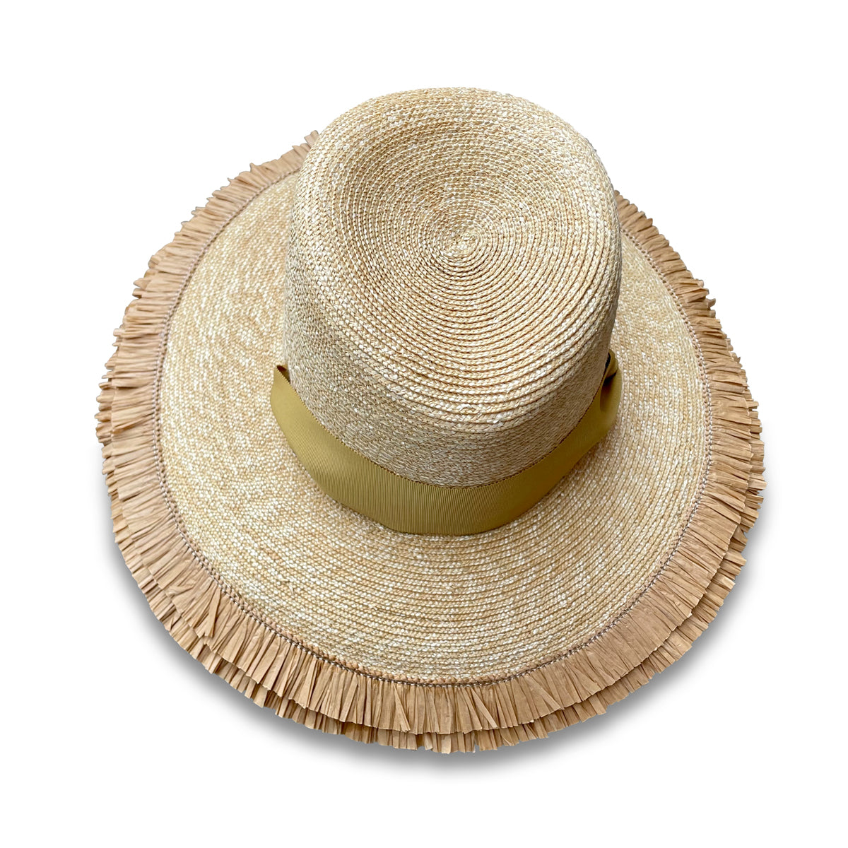 Wheat Straw Beach hat. View from the top. Brim features a double row of Raffia fringe. The hat has two grommets on each side of the crown with a matching ribbon threaded through. The ribbon acts as a chin ribbon.  