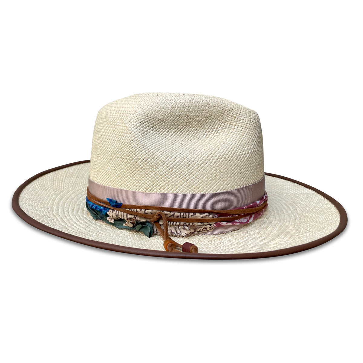 Natural Panama Fedora with leather piping on the brim. Silk Sari trim with leather cord. Right side view. Three inch brim. 