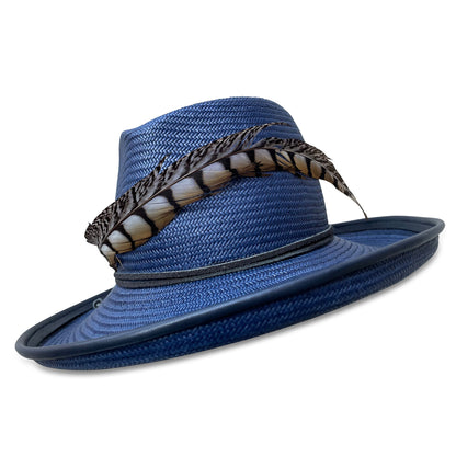 Navy Straw Fedora with upturned brim and pheasant tail trim. Brim is piping with navy lambskin.